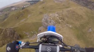 Adrian Owen rides off cliff